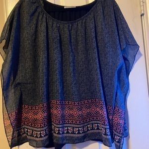 Sheer with under shirt, no size tag but fits a large. Flower print at bottom